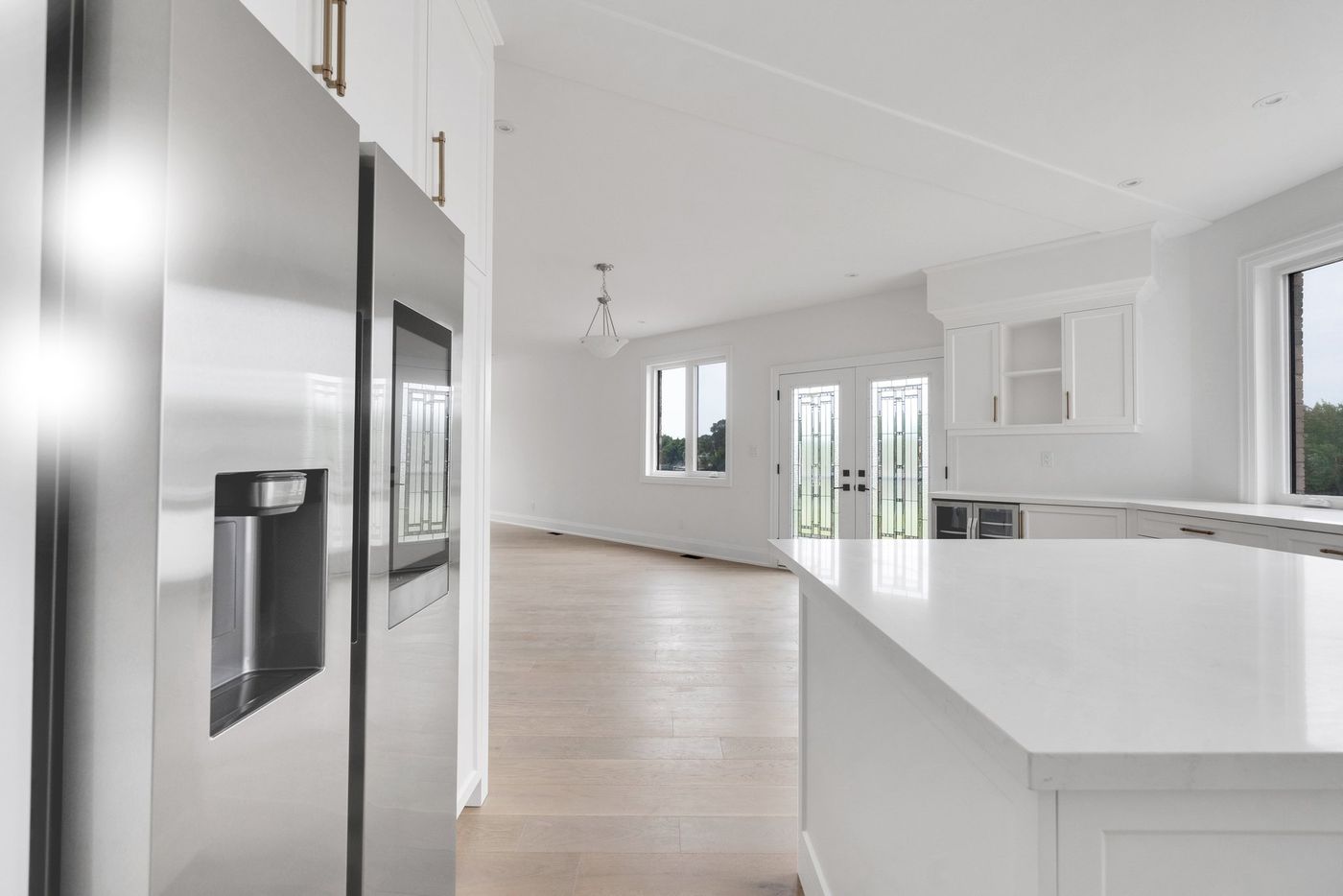 View past the fridge to the great room and garden doors
