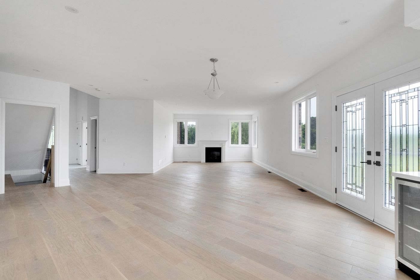 Great room with fireplace and leaded-glass garden doors