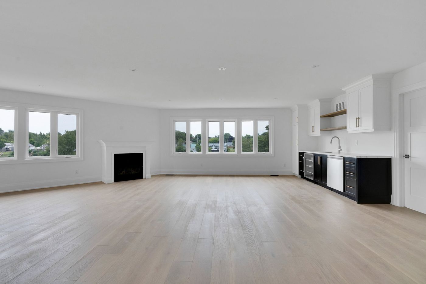 Lower-level family room with fireplace and wet bar